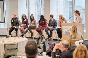 Panel discussion, a row of people sitting in chairs