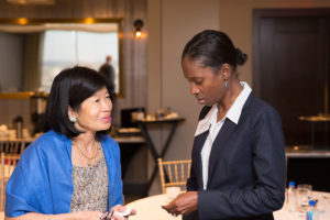 Anne Marie Boursiquot King, Senior Program Office at RIZE chats with Vivian Li at the Sharing Solutions—Massachusetts Opioids and the Workforce Program. Co-hosted by the US Chamber of Commerce Foundation, the Greater Boston Chamber of Commerce, and RIZE. September 2019
