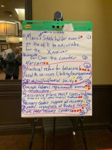 Giant Post-It on an easel with notes at the Together in Recovery statewide convening